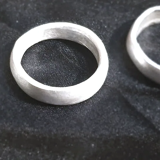 A band filed down to an even width, still flat-edged and dull. (in process of finishing)