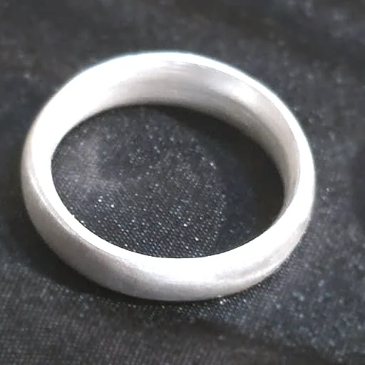 A band domed and sanded to an even satin grey. (finished product)