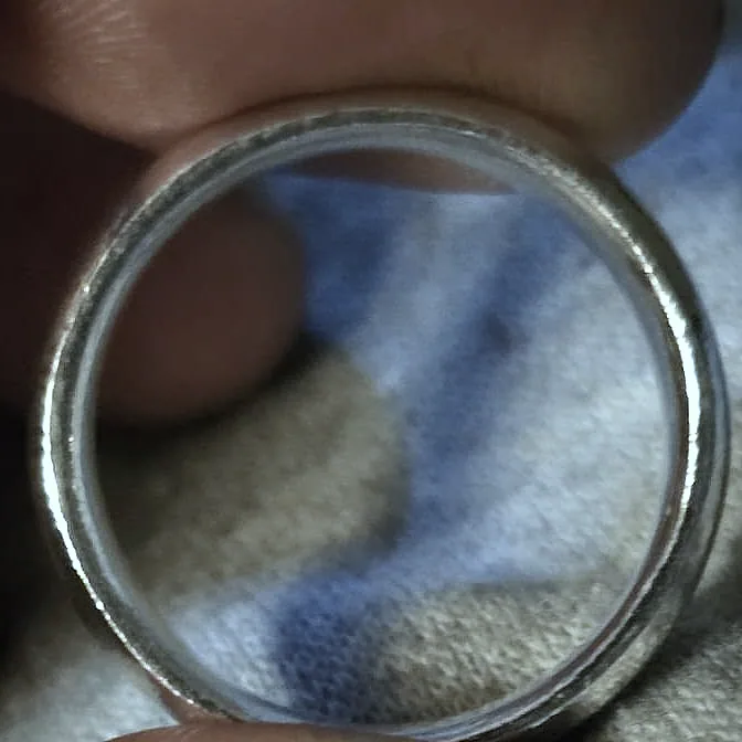 Looking through a domed band at its smooth polished inside face. (finished product)