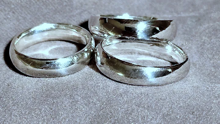 Three domed silver bands, close together and mirror polished. (finished product)