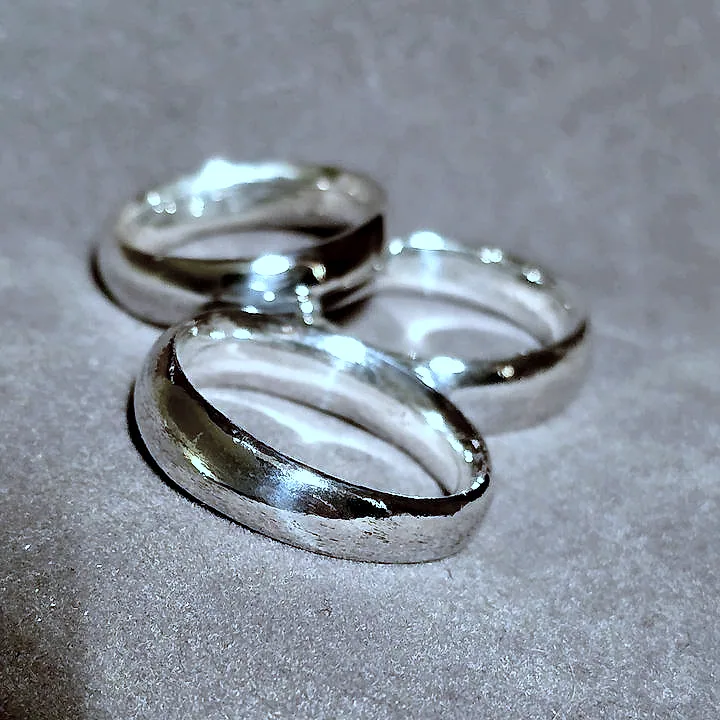 Three domed bands stacked loosely against each other. (finished product)