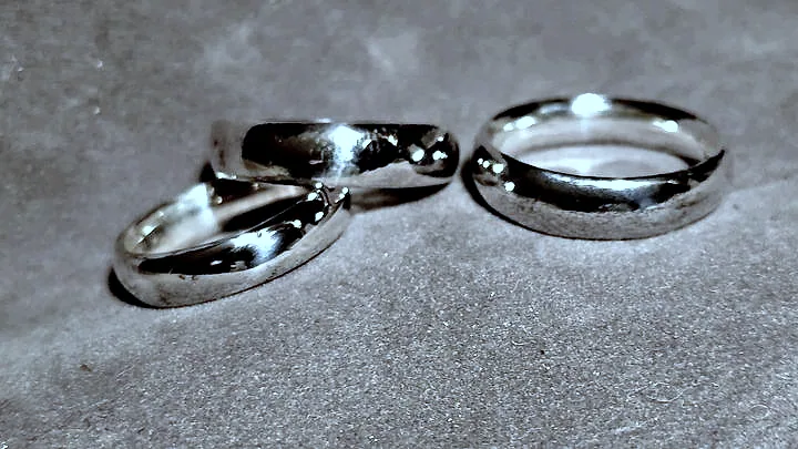 Three domed silver bands on a neutral backdrop, side lit. (finished product)