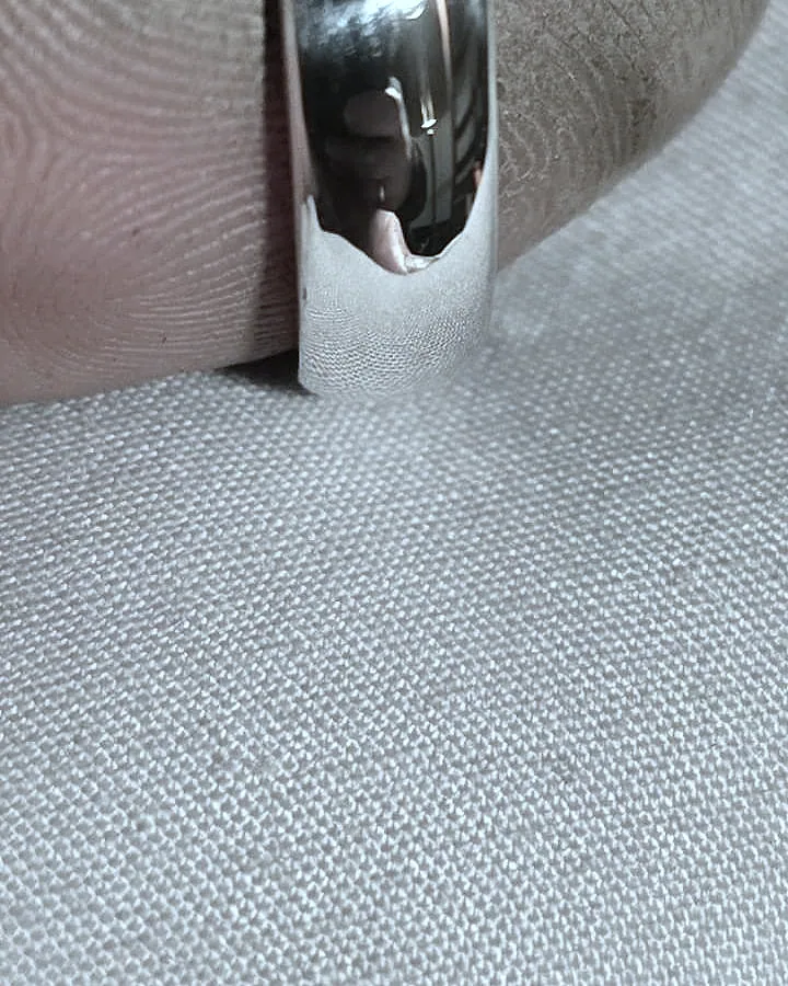A heavy domed band worn, showing its depth and mirror finish. (finished product)